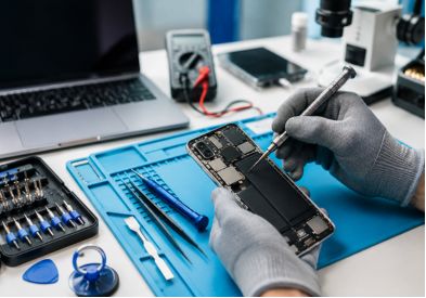 Expert technician repairing smartphone at a mobile repair center in Al Barsha Dubai